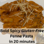 Gluten-free penne pasta tossed in spicy red sauce with shredded parmesan. Hot and ready to eat.